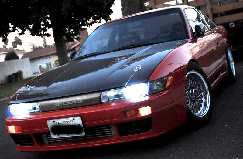 Blitz LM Intercooler peeking through OEM Silvia Aero Bumper and JDM Brick style headlights round out the front end.