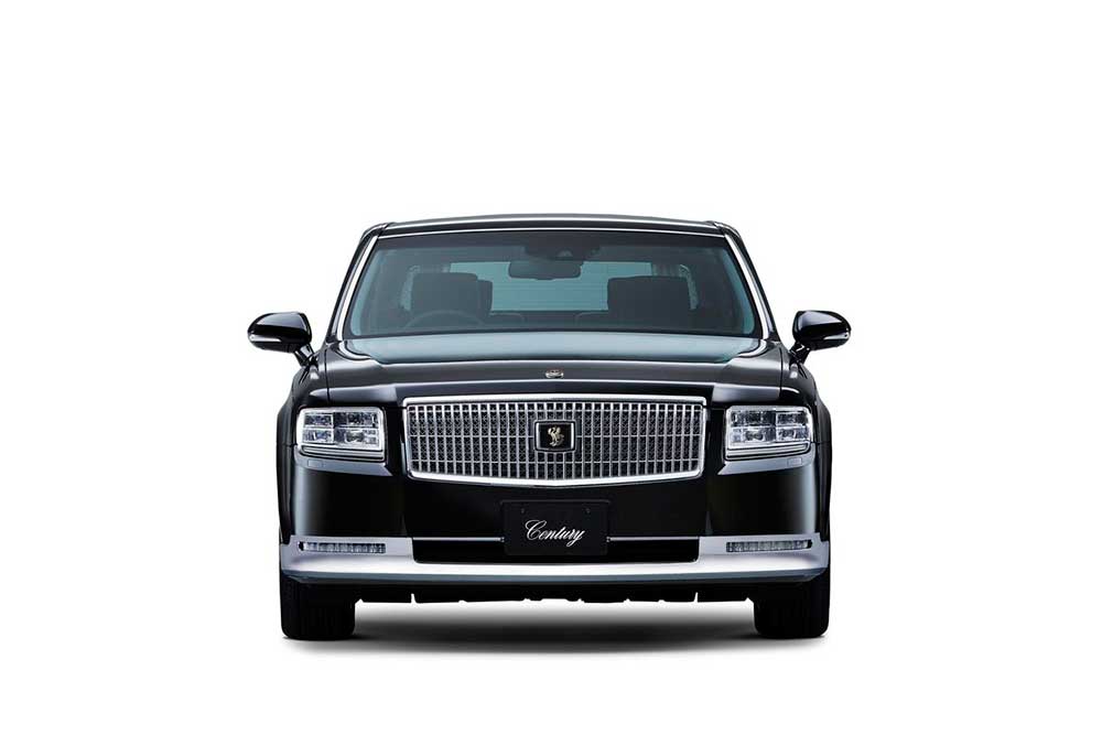 Front view of the 2018 Toyota Century HYBRID, a large chrome grll encases the Toyota Century which is a mythical japanese bird, the Fushichō. Headlights are now triple projectors. - 2018 Toyota Century HYBRID The Ultimate in JDM Luxury